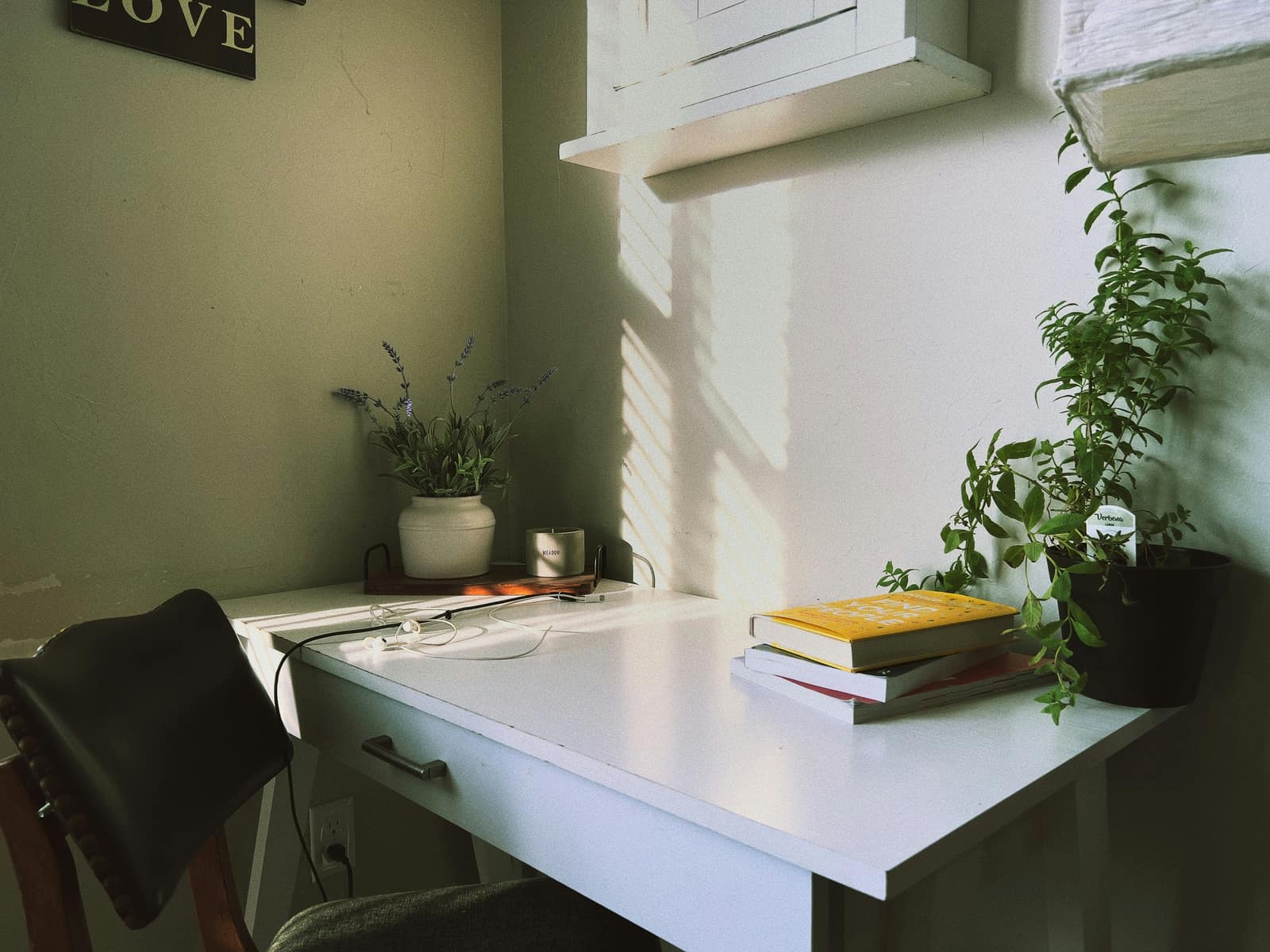 A warm, uncluttered home workspace with natural light, evocative of a relaxed telehealth setting
